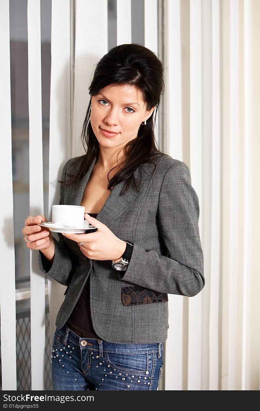 Young happy caucasian businesswoman with cup of coffee. Young happy caucasian businesswoman with cup of coffee