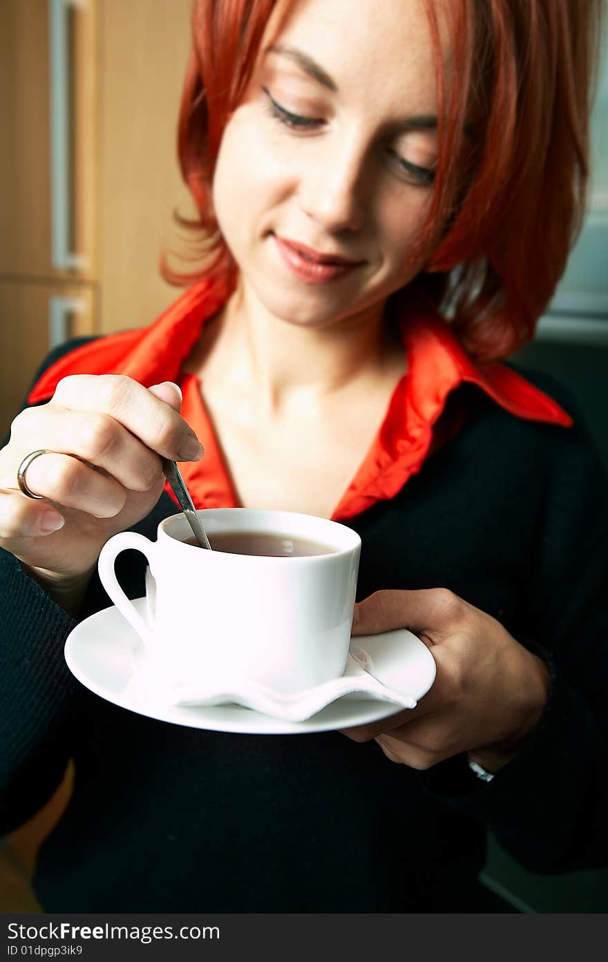 Young happy caucasian businesswoman with cup of coffee. Young happy caucasian businesswoman with cup of coffee