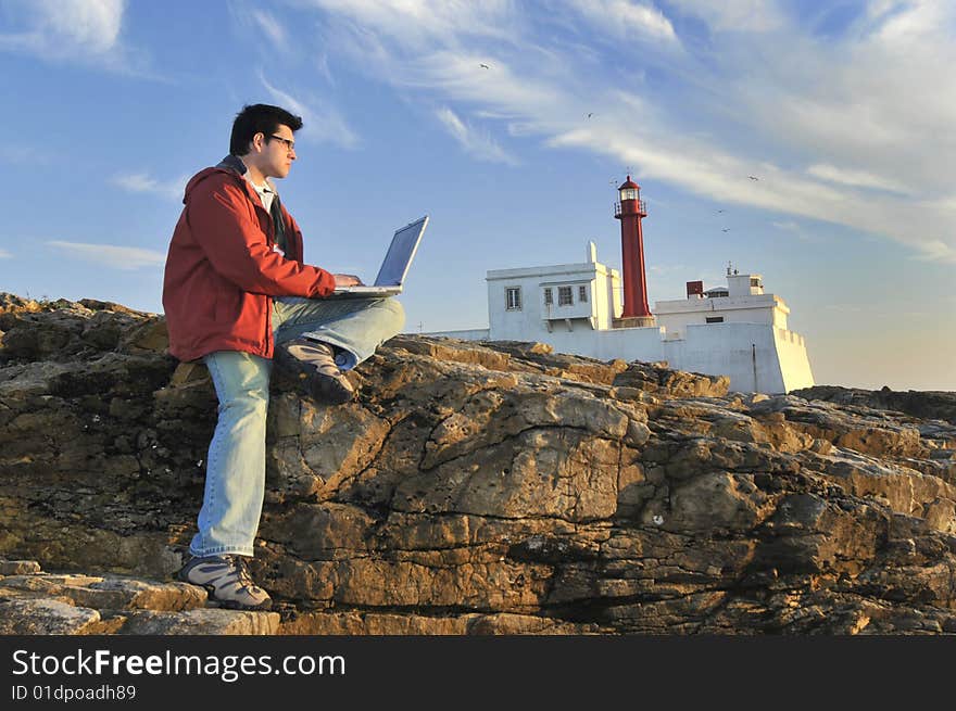 Young man outdoor with laptop. Young man outdoor with laptop