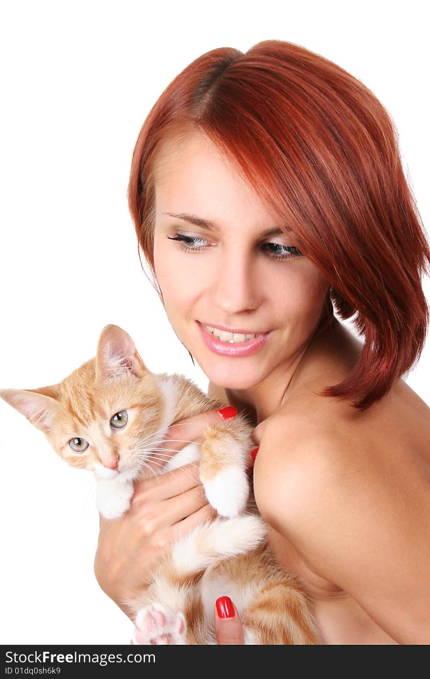 Beautiful redhead girl with red fluffy kitten. Beautiful redhead girl with red fluffy kitten