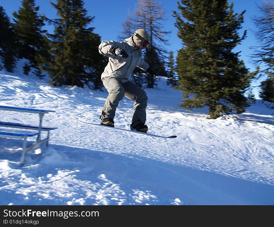 Snowboarder jumps off the table