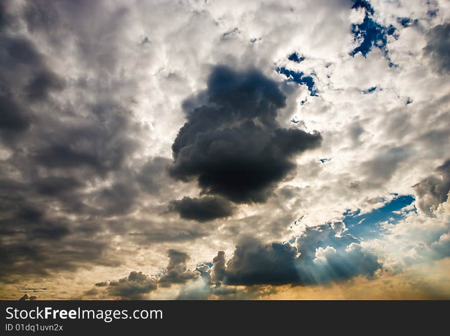 Cloudscape with sun ray shining through.