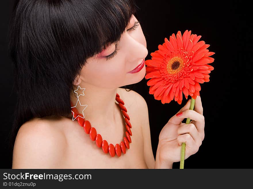 Young woman with red flower