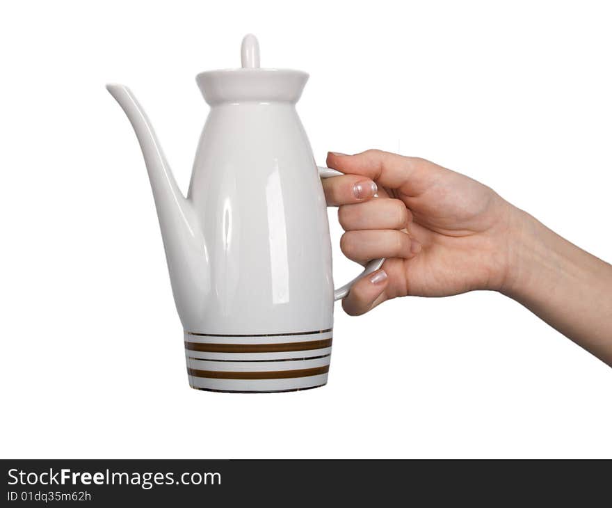 Female hand keeps teapot