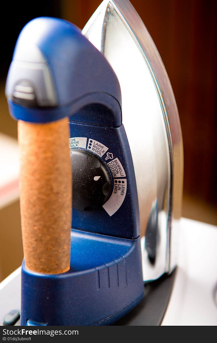 Dusty Iron inside home environment. Focused on temperature control knob.