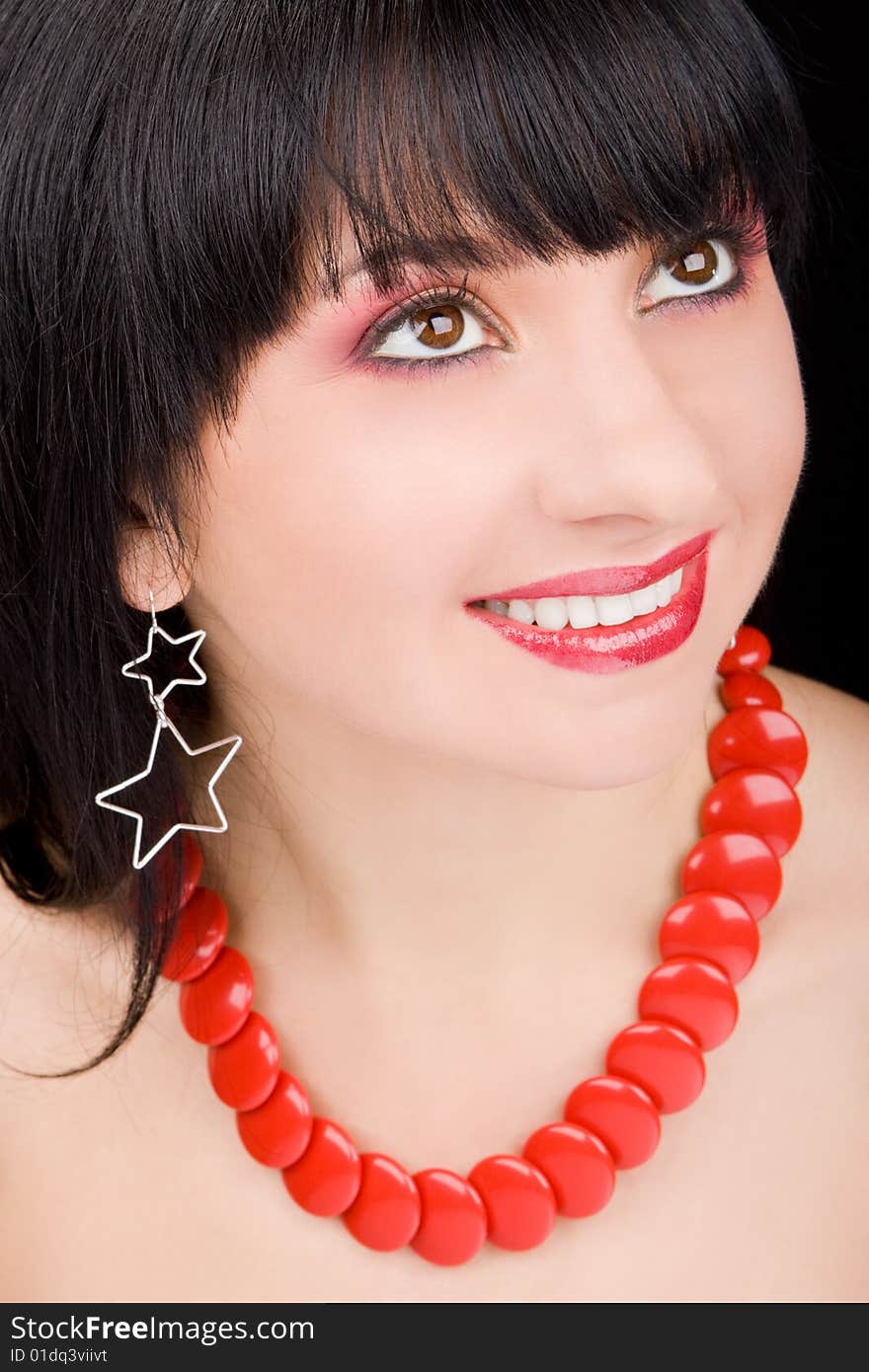 Portrait of the charming woman on black background