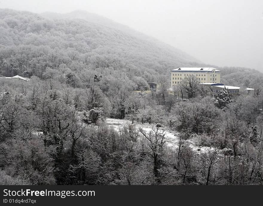 Castle in mountains in the forest in winter time. Castle in mountains in the forest in winter time