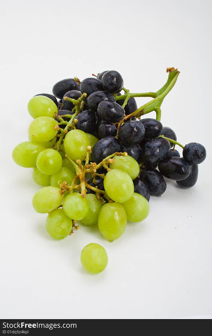 A large bunch of fresh red and white grapes. A large bunch of fresh red and white grapes