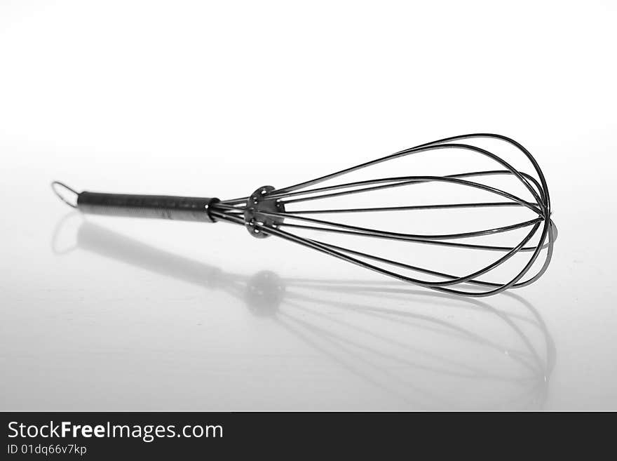 Wire whisk isolated on white