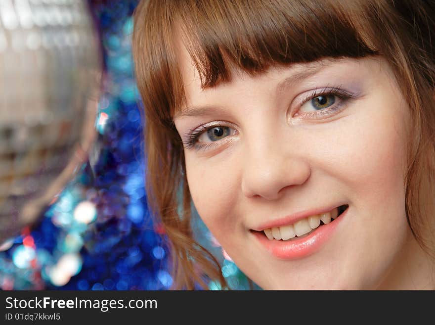 Beautiful lady in night club standing near the small disco ball. Beautiful lady in night club standing near the small disco ball