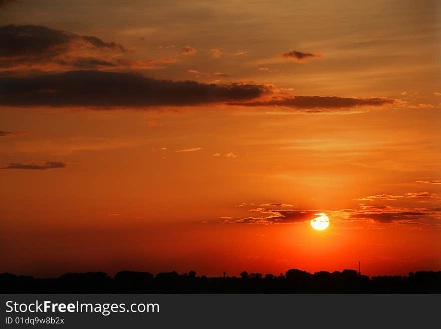 Sunset above a village