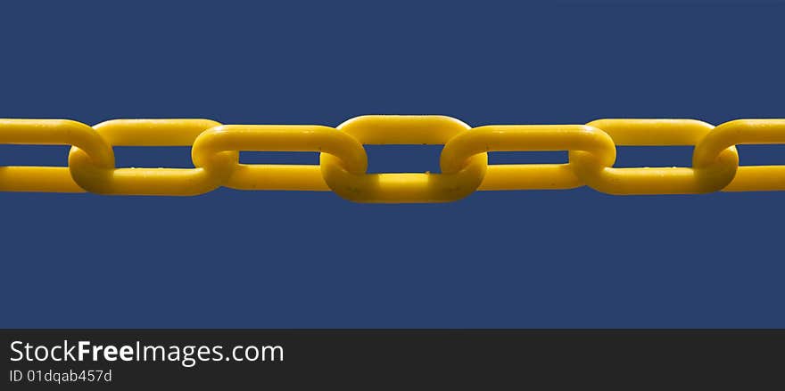 Close up of unbroken chain link set against blue sky background for copy text