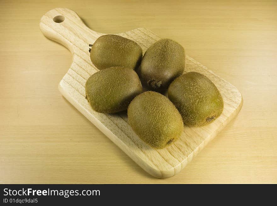 Kiwi fruits on cutting board