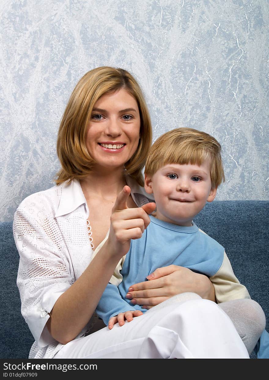 Portrait of young mum with the beautiful small son. Portrait of young mum with the beautiful small son