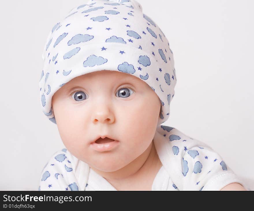 Small cute surprised child in blue pajama. Small cute surprised child in blue pajama