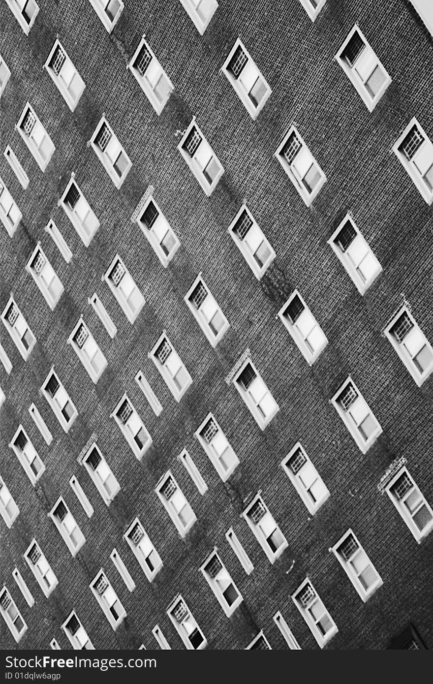 These are windows in a building on a boardwalk near a beach.