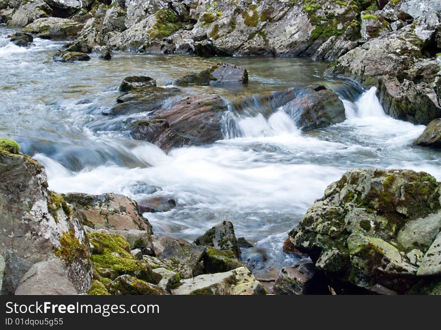 Mountain stream with cataracts in Norway