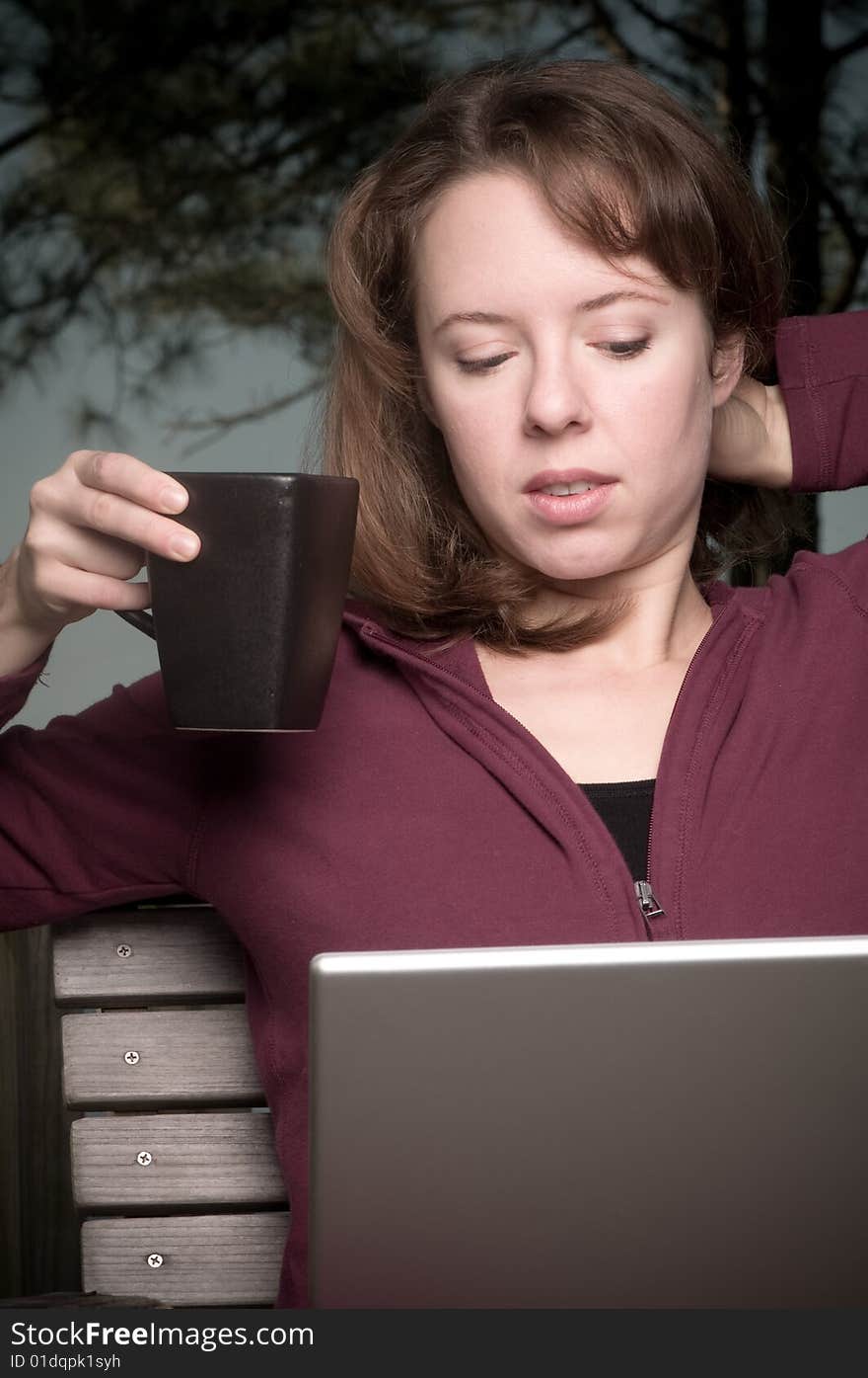 Young Woman with Coffee and Laptop