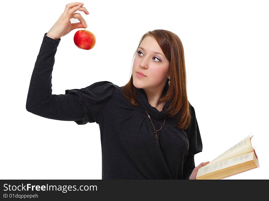 The girl with the book and a red apple on a white background. The girl with the book and a red apple on a white background