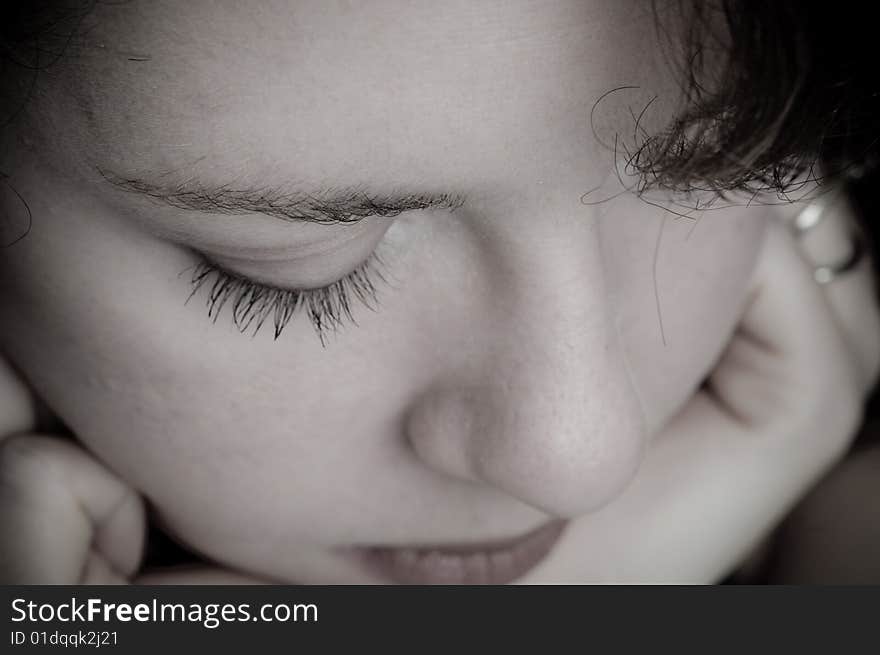 Close-up of woman deep in thought. Close-up of woman deep in thought.