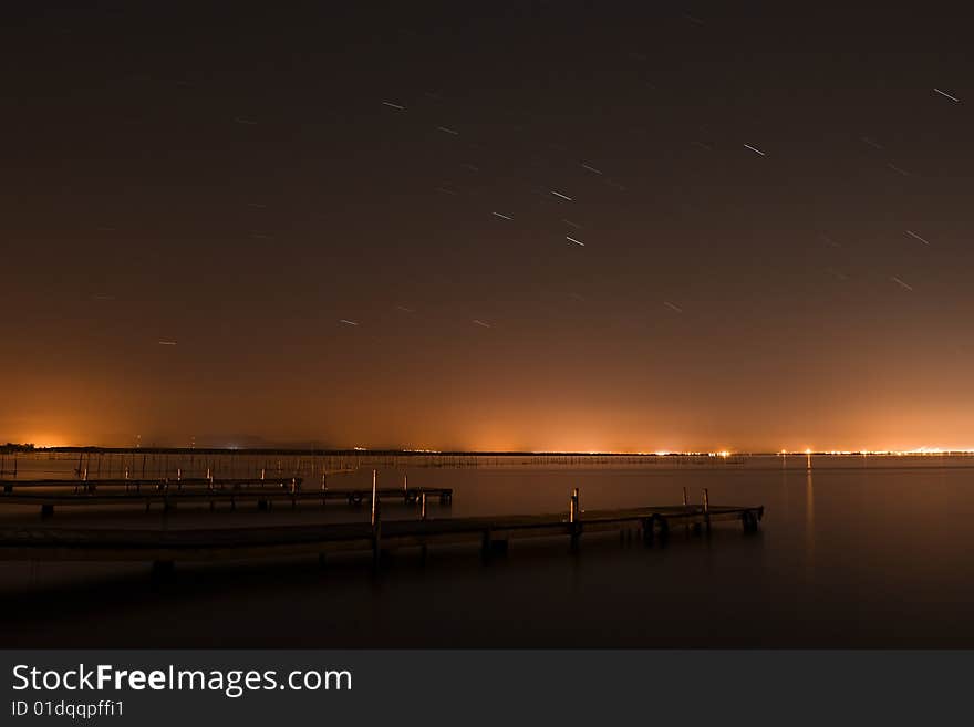 Long exposed stars over lake.