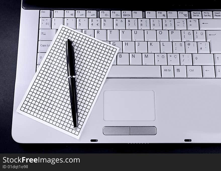 Laptop notepaper and pencil on white background. Laptop notepaper and pencil on white background