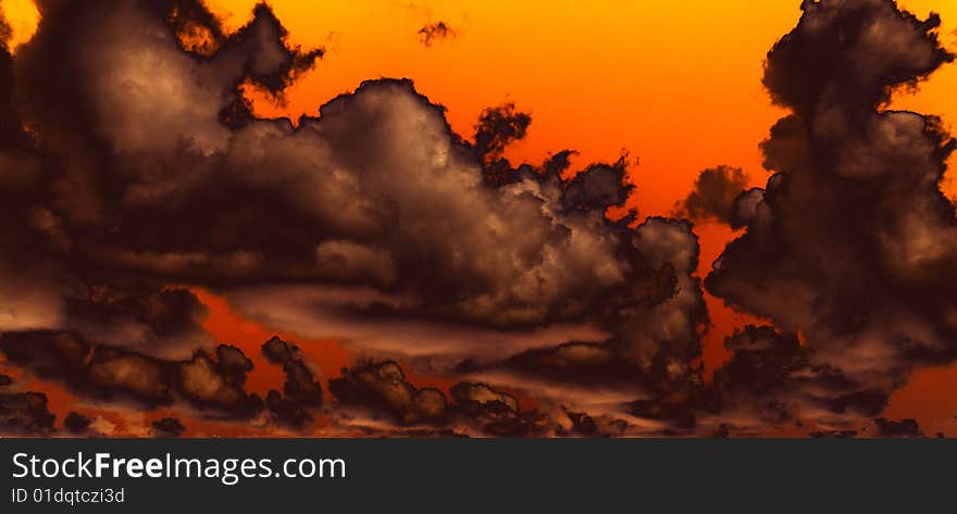 Dark clouds in sunset, orange tones