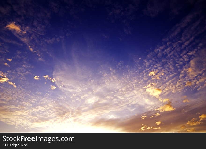 Sunset with different shape of clouds