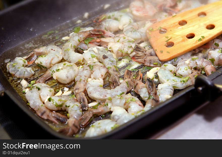 The photograph of fried seafood on the frying pan (shrimps). The photograph of fried seafood on the frying pan (shrimps)