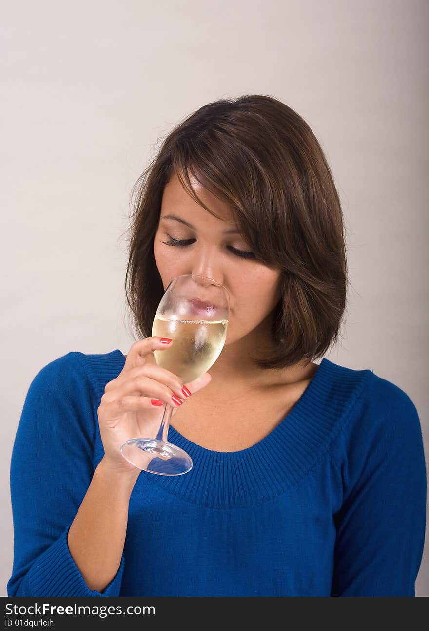 Girl drinking a glass of white wine