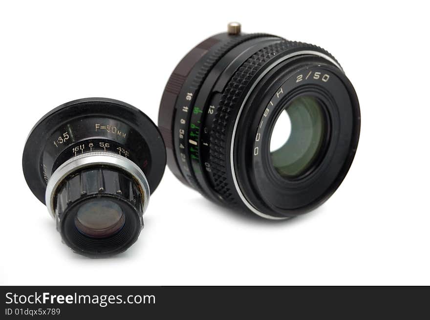 Two old vintage camera lens against white