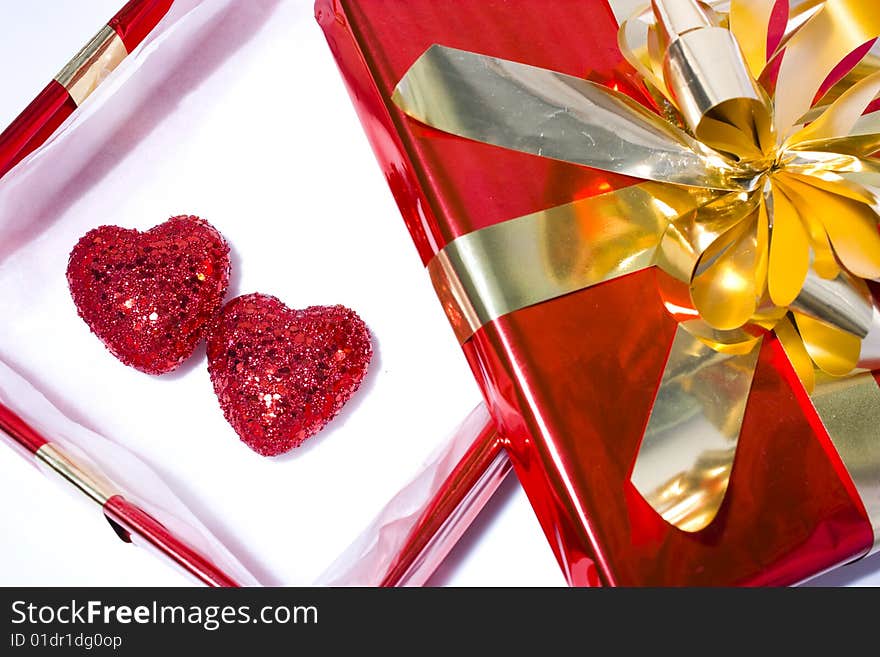 Two hearts in a open gift box. Two hearts in a open gift box.