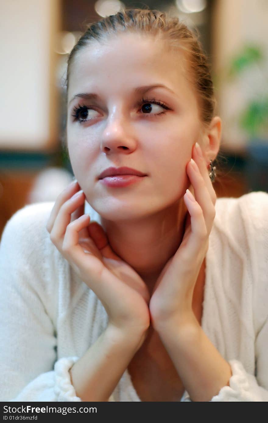 Portrait of beautiful woman in white sweater. Portrait of beautiful woman in white sweater