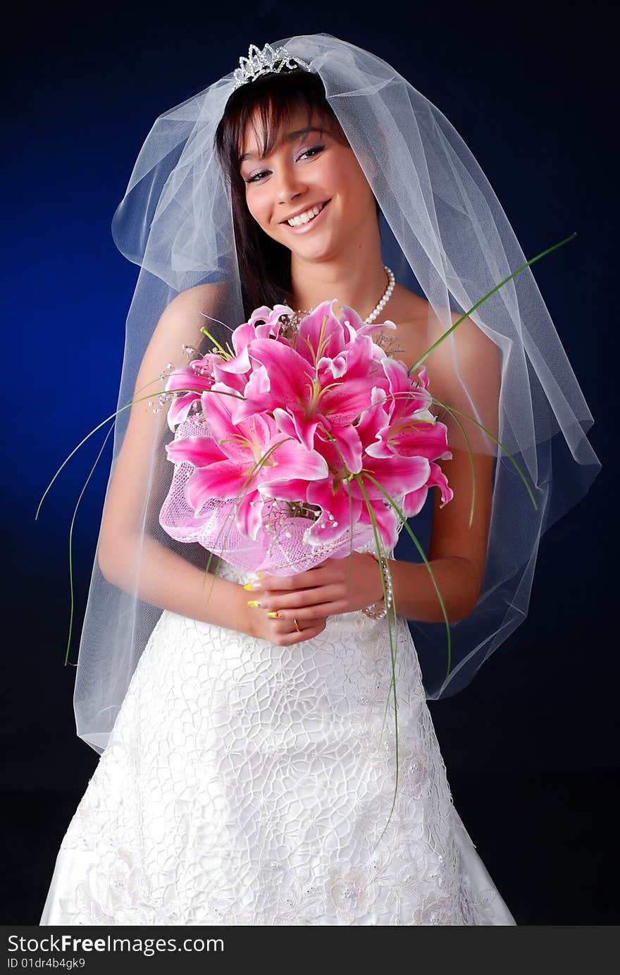 Portrait of young dark-hair bride with bouquet of lilys. Portrait of young dark-hair bride with bouquet of lilys