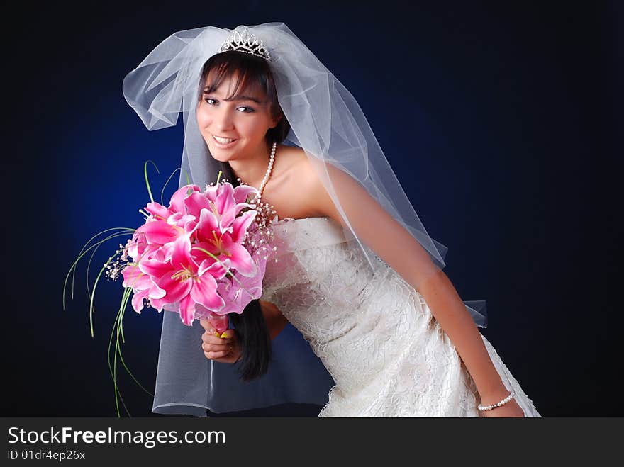 Portrait of young dark-hair bride with bouquet of lilys. Portrait of young dark-hair bride with bouquet of lilys