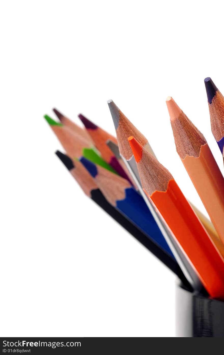 Thick colored pencils against a white background