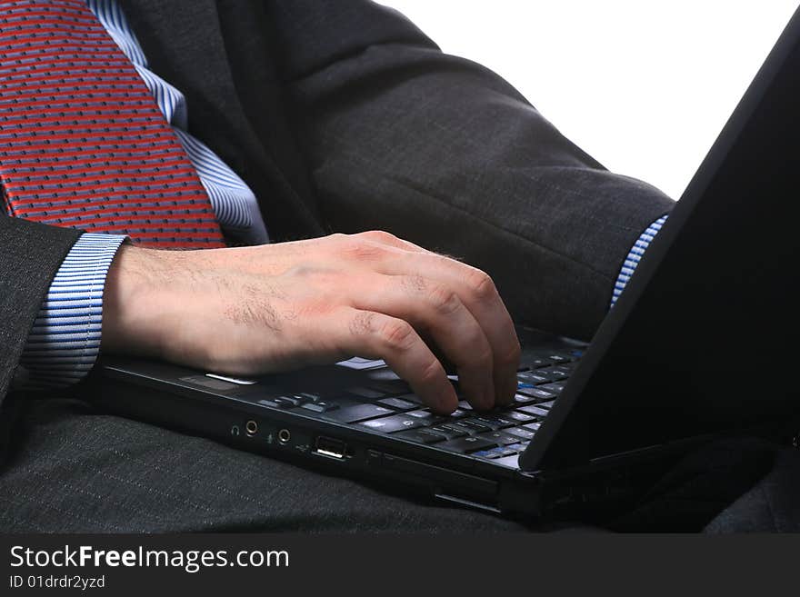 Businessman with the computer, isolated on a white background