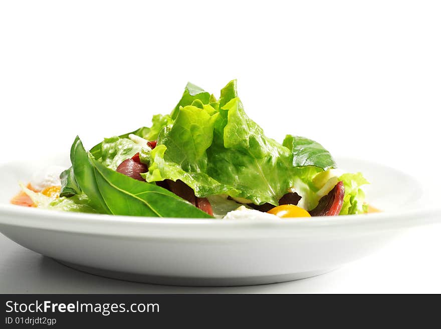 Salad - Smoked Magret (Duck Breast) with Red Chaud-Froid Sauce. Comprises Tomato and Vegetable Leaf. Isolated on White Background. Salad - Smoked Magret (Duck Breast) with Red Chaud-Froid Sauce. Comprises Tomato and Vegetable Leaf. Isolated on White Background