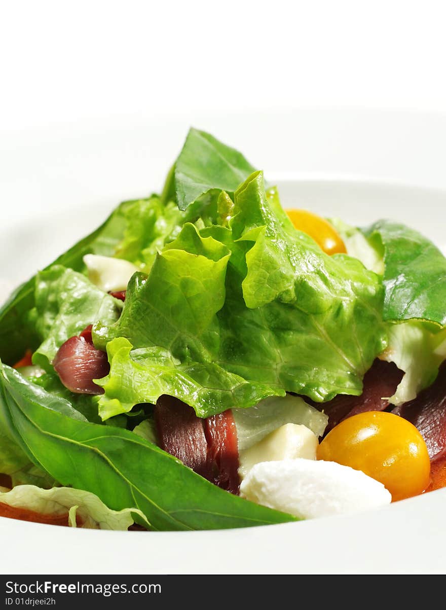 Salad - Smoked Magret (Duck Breast) with Red Chaud-Froid Sauce. Comprises Tomato and Vegetable Leaf. Isolated on White Background. Salad - Smoked Magret (Duck Breast) with Red Chaud-Froid Sauce. Comprises Tomato and Vegetable Leaf. Isolated on White Background