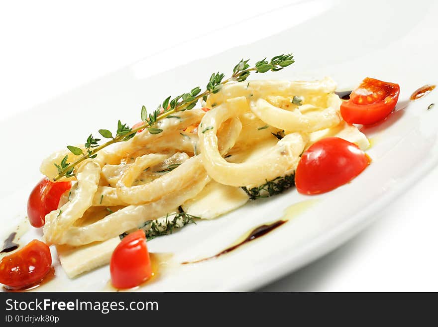 Salad with Calamari Rings, Sheep Cheese and Tomato. Isolated on White Background. Salad with Calamari Rings, Sheep Cheese and Tomato. Isolated on White Background