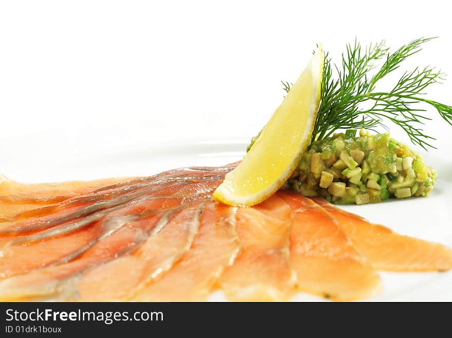 Salt Salmon with Avocado Frappe and Lemon Slice. Isolated on White Background