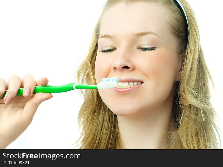 Attractive Blond Woman Brushing Her Teeth