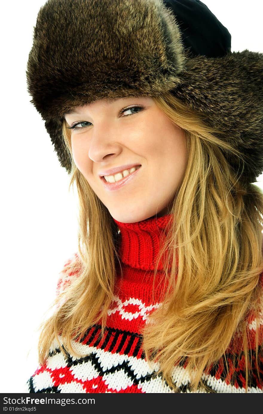 Happy beautiful blond woman wearing a fur hat and red sweater. Happy beautiful blond woman wearing a fur hat and red sweater