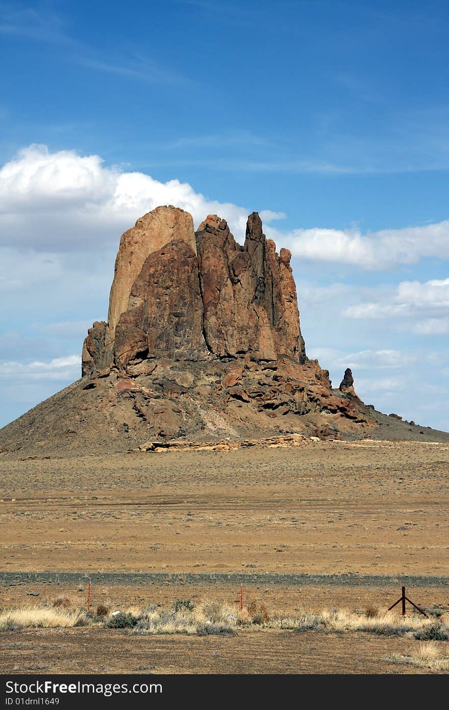 A lone mountain or butte in the Utah desert, actually in grazing grounds, though it looks very dry. A lone mountain or butte in the Utah desert, actually in grazing grounds, though it looks very dry