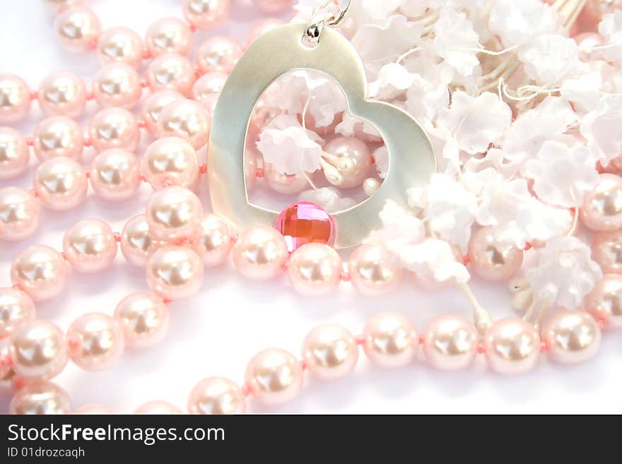 Necklace with heart and pink stone on it,pink pearls and white fabric flowers. Necklace with heart and pink stone on it,pink pearls and white fabric flowers.