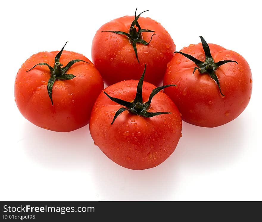 Red tomatoes isolated on white background. Studio light.