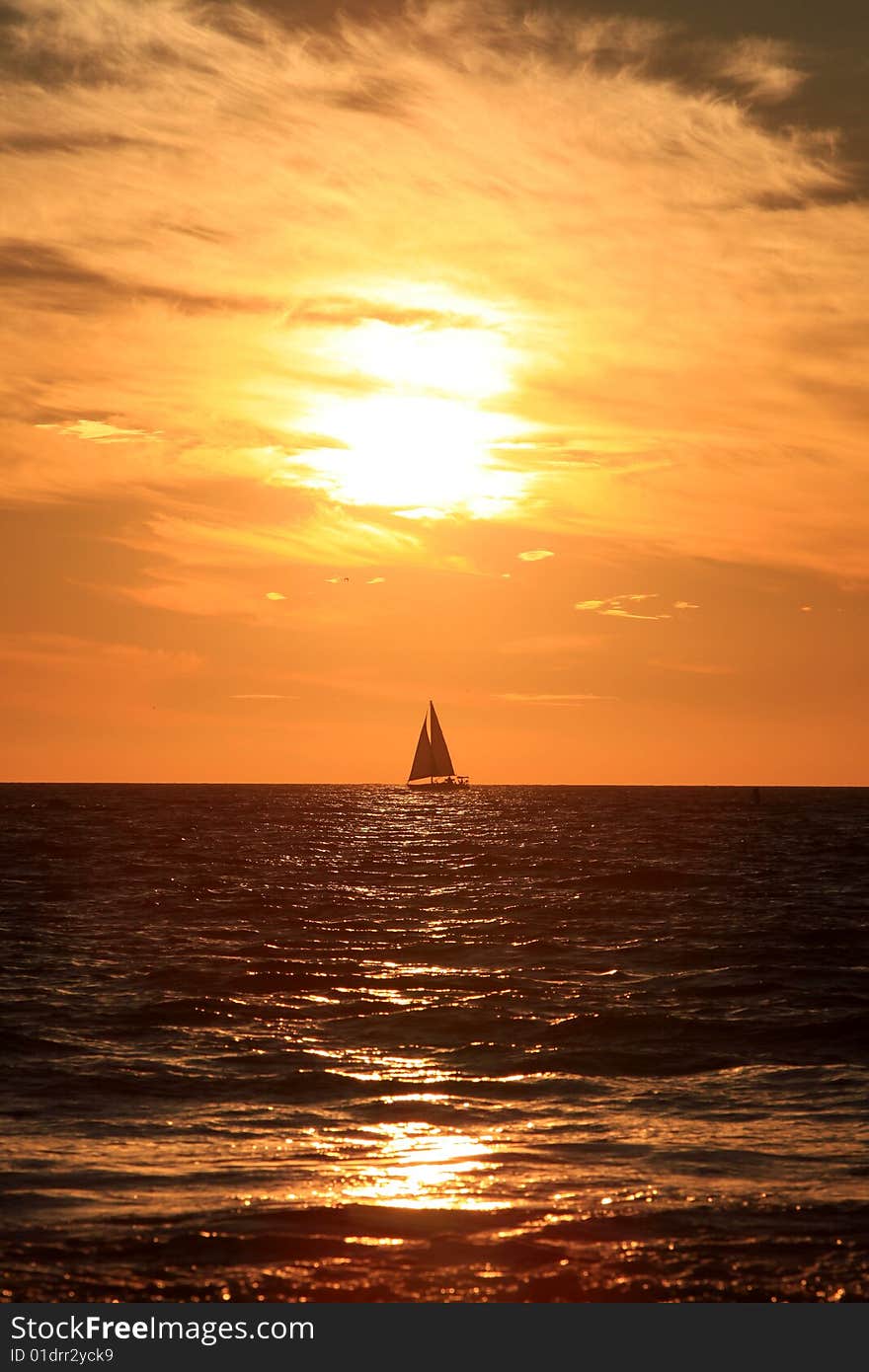 Sunset and sailing ship in Santa Mornica beach