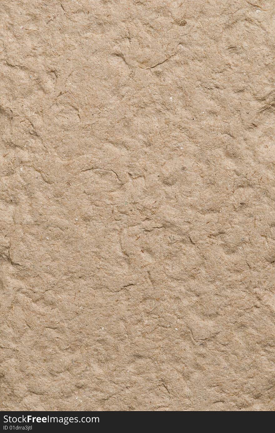 Recycled brown fiber cardboard for use as background texture. Recycled brown fiber cardboard for use as background texture