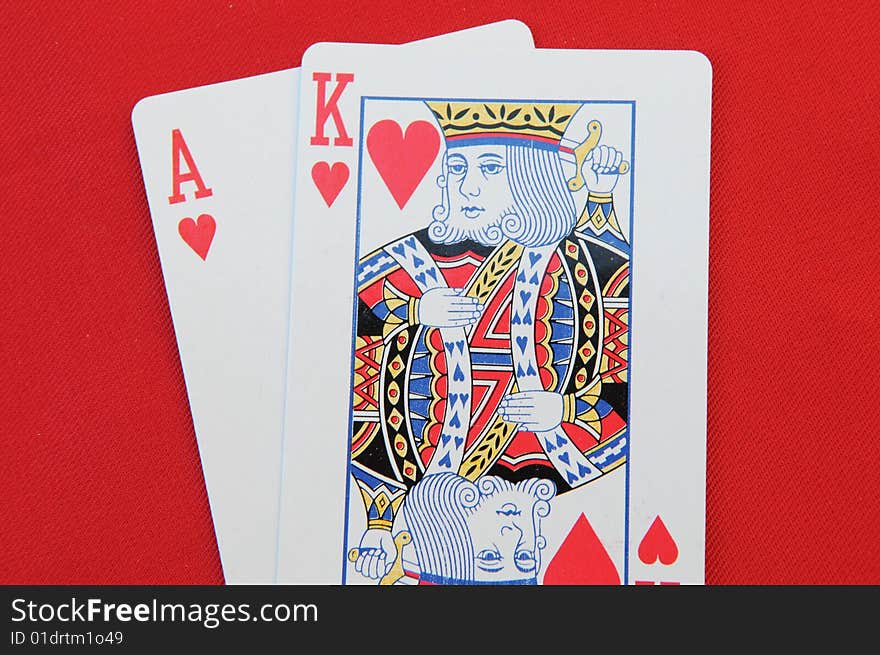 The heart king and A card on the red background. The heart king and A card on the red background.