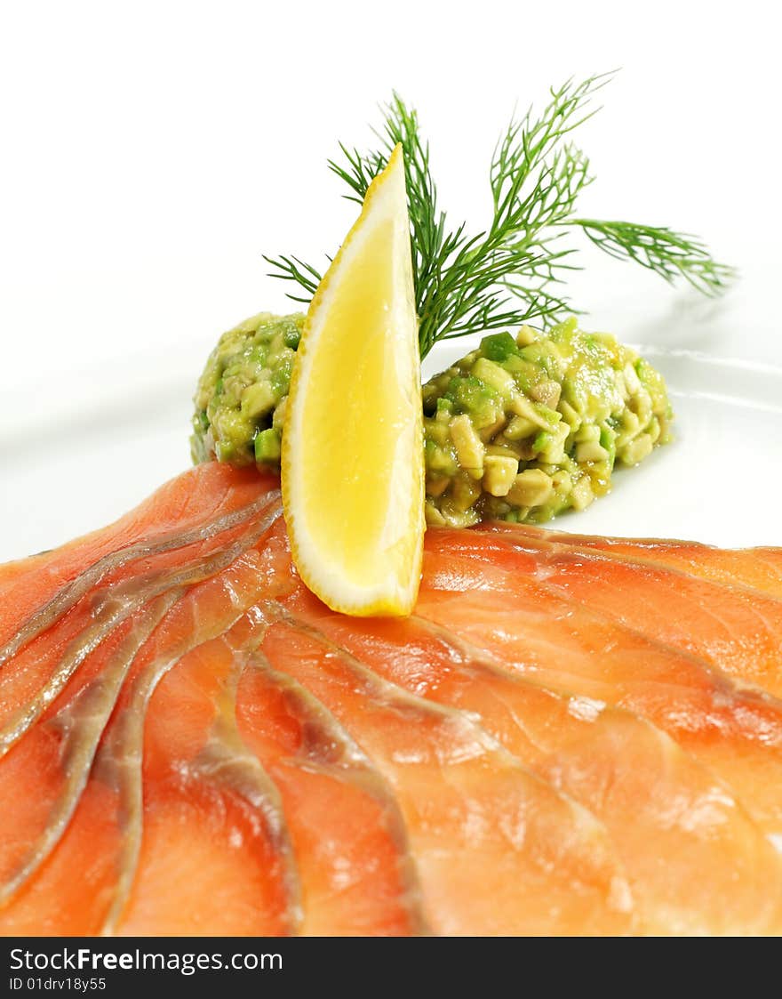 Soft Salt Salmon with Avocado Frappe and Lemon Slice. Isolated on White Background